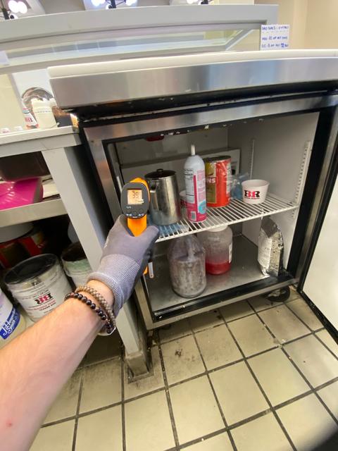 Cabinet and infrared thermometer.