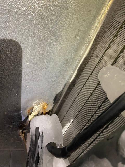 Evaporator face relatively clear of excess ice.