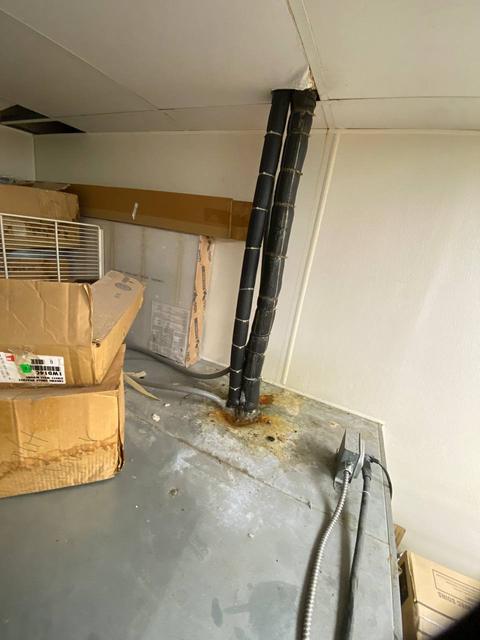 Exterior top of enclosure and line penetration.