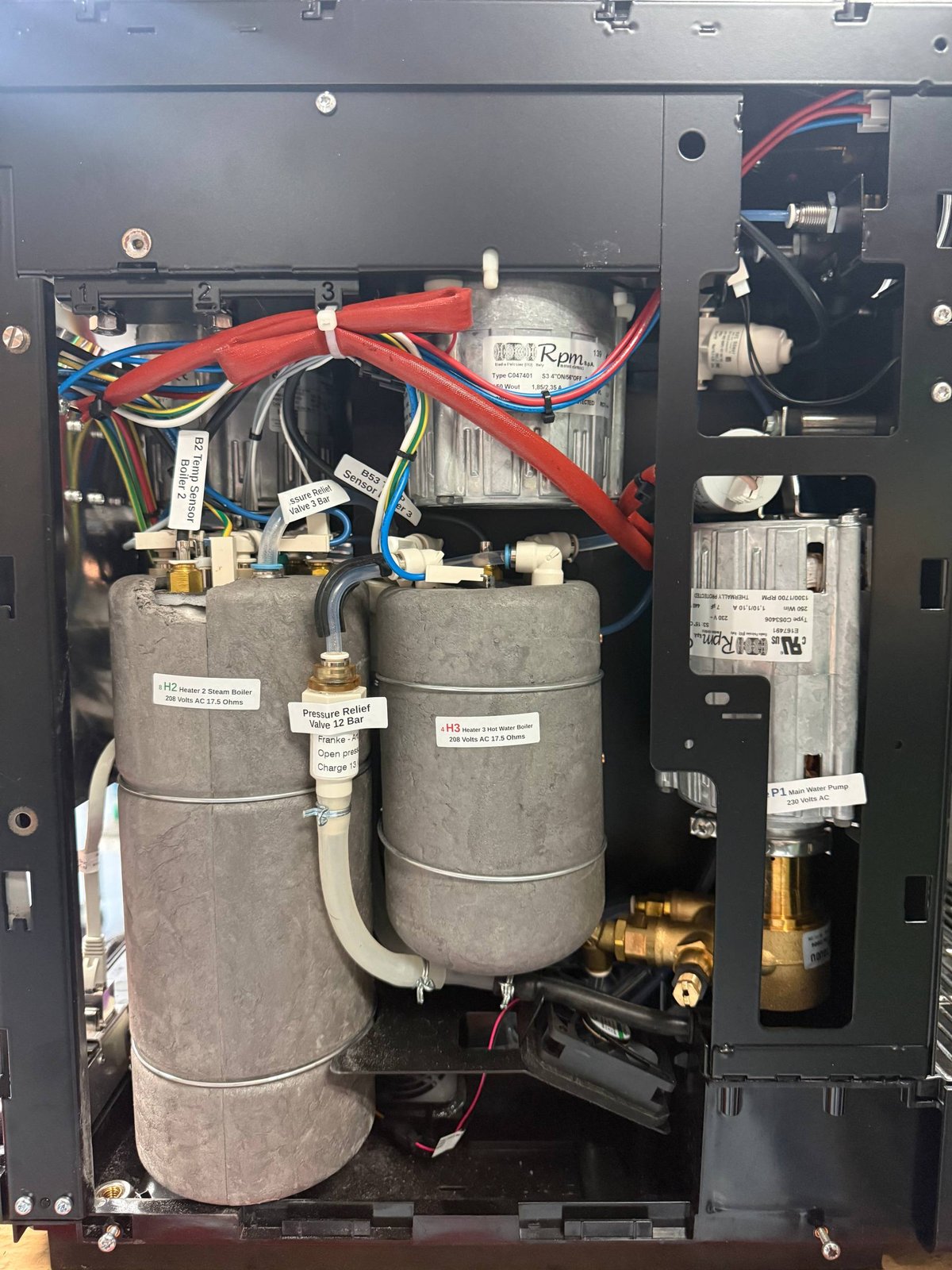 Two boilers inside an open Franke coffee machine