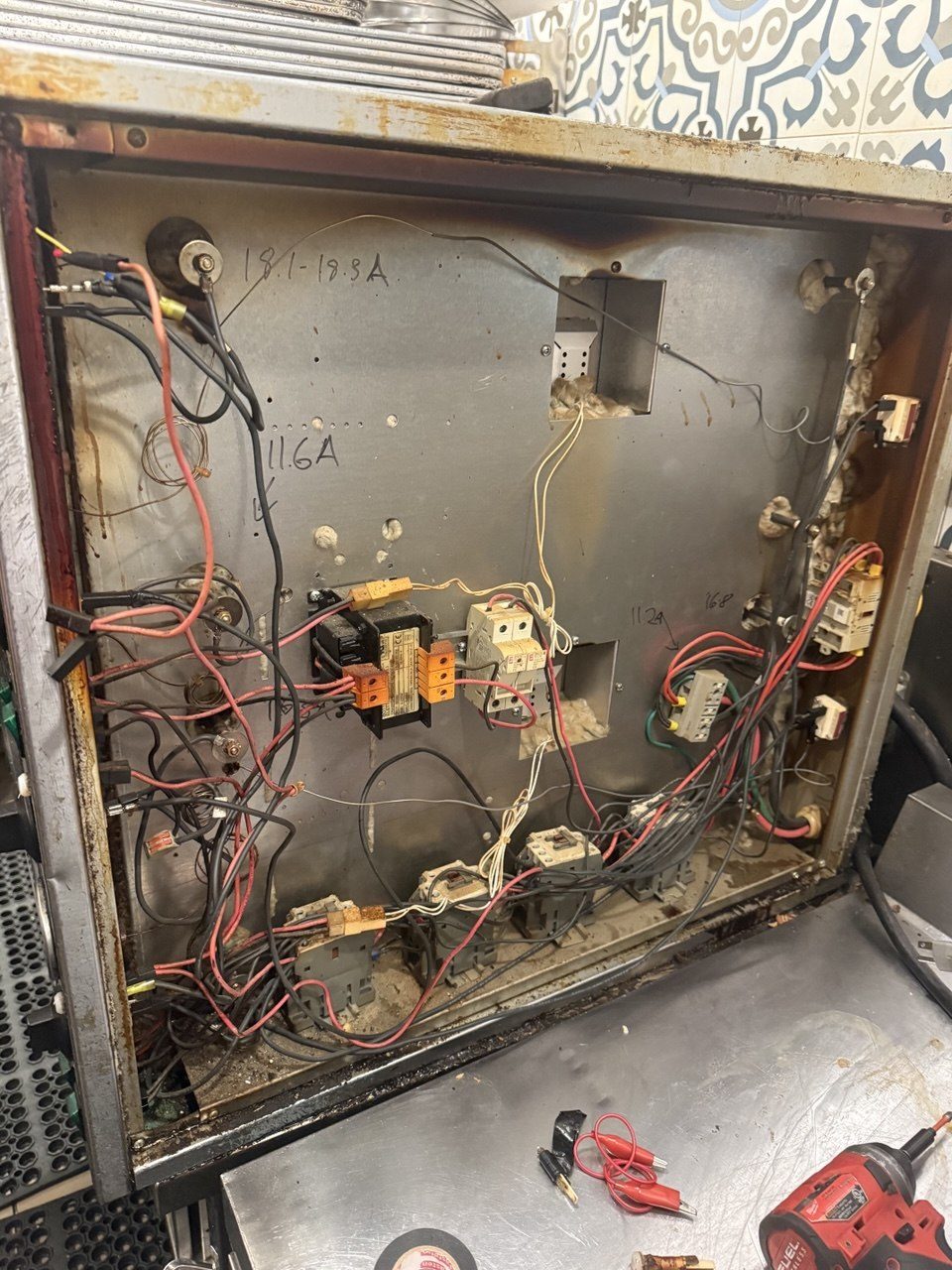 Cuppone oven control box interior with transformer, contactors, and wiring during diagnosis