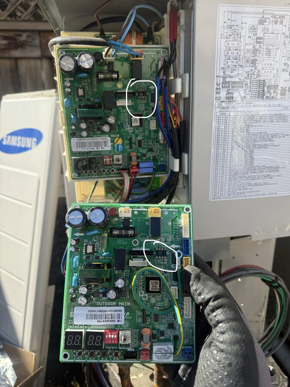 Samsung mini-split outdoor main control board removed during a PCB replacement, with the unit wiring diagram, in Pleasanton